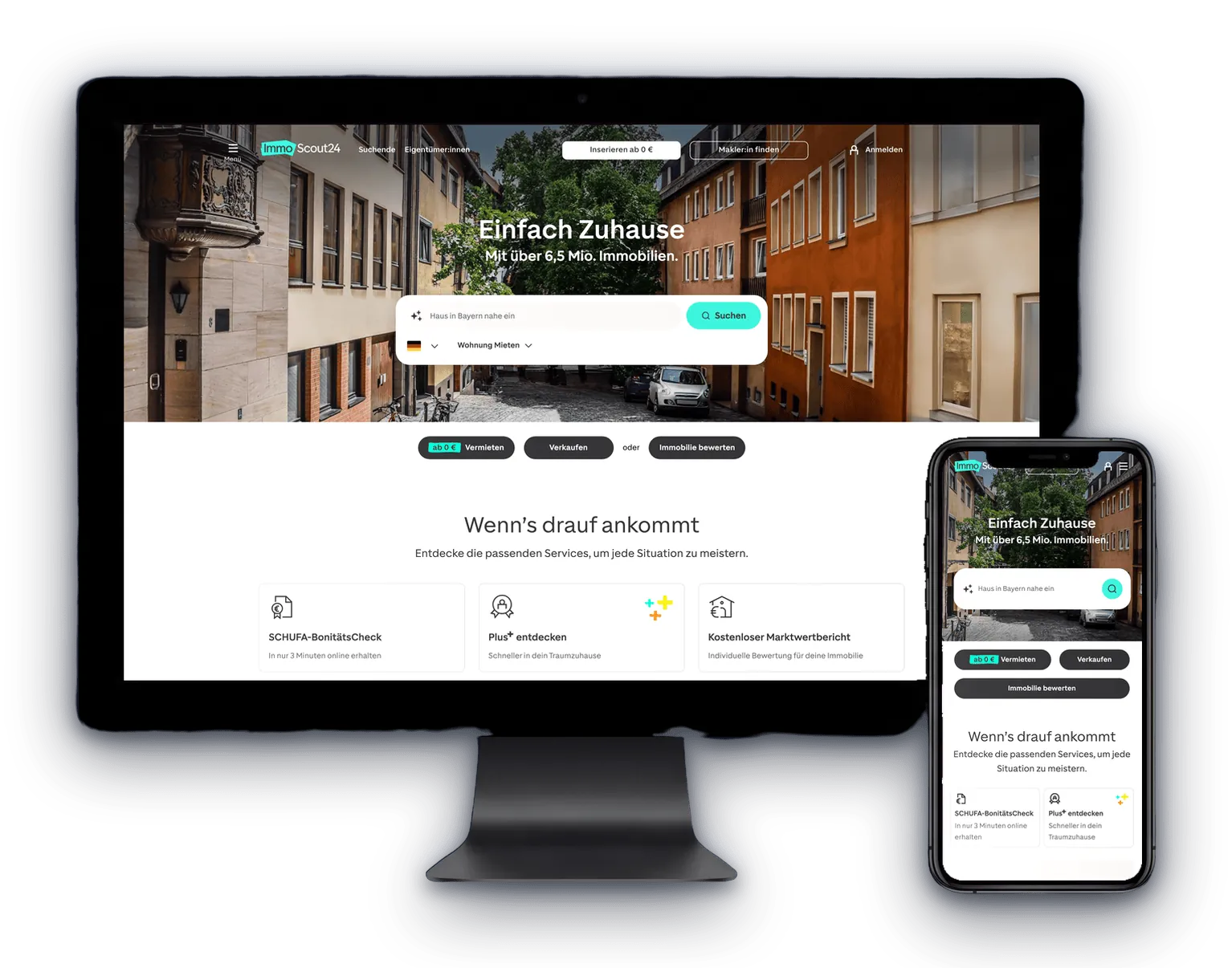 ImmoScout24 website shown on a desktop display and a smartphone